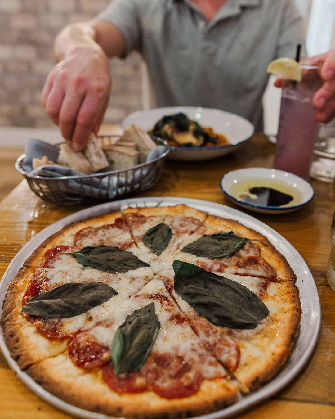 Man eats a pizza in the best restaurant in Starkville, Mississippi