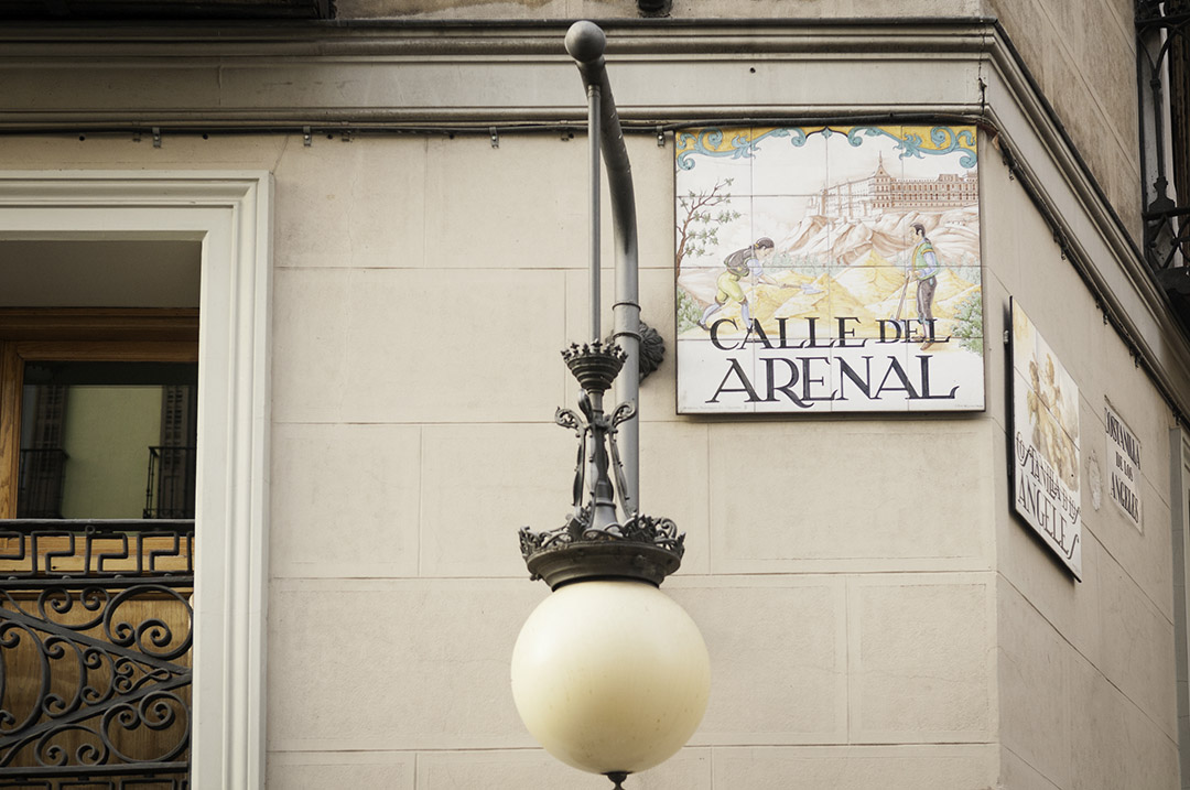 Close-up of a traditional ceramic street sign in Madrid's historic old town.