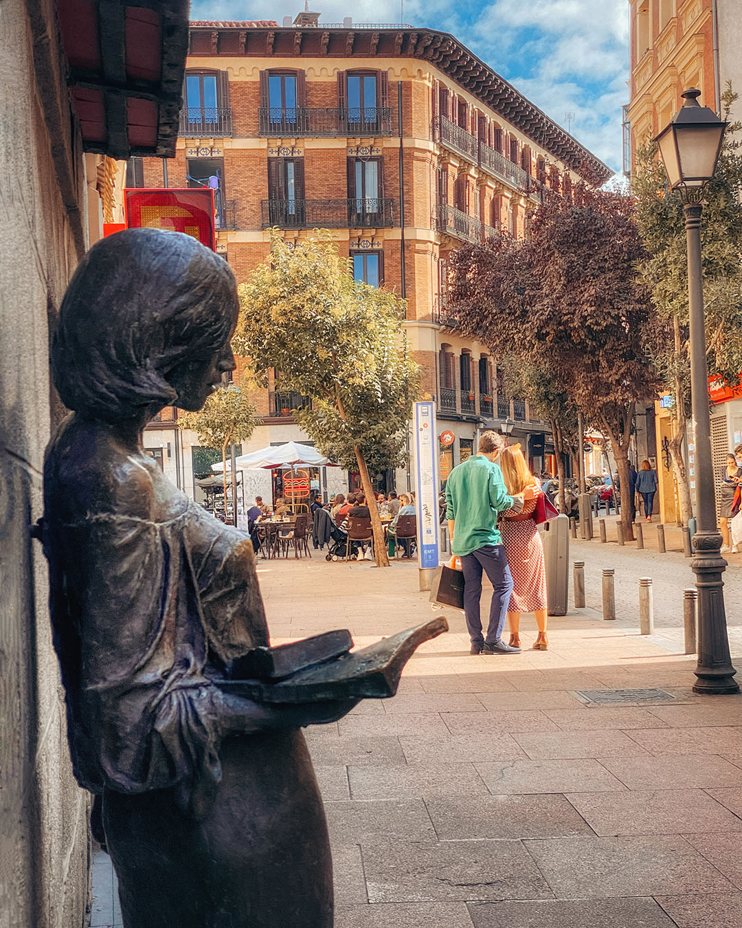 The famous "Julia" statue in the Malasaña district, showcasing Madrid's local street culture.