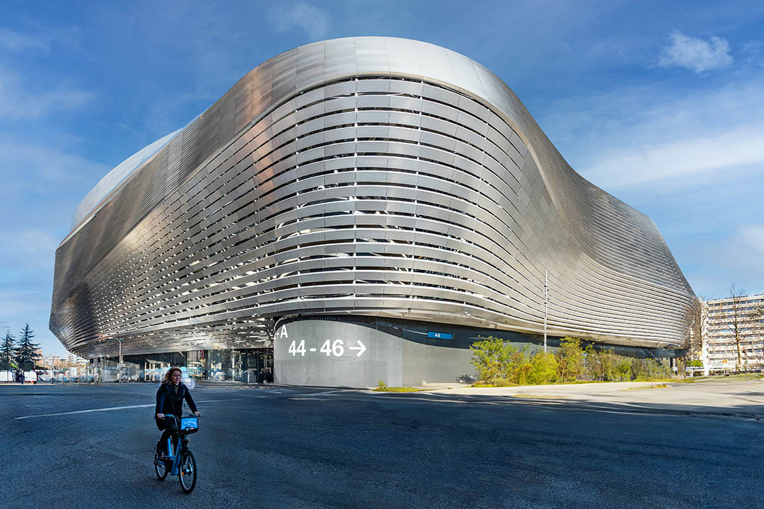 The modern metallic facade of the renovated Santiago Bernabéu Stadium, home of Real Madrid, showing its futuristic architecture.